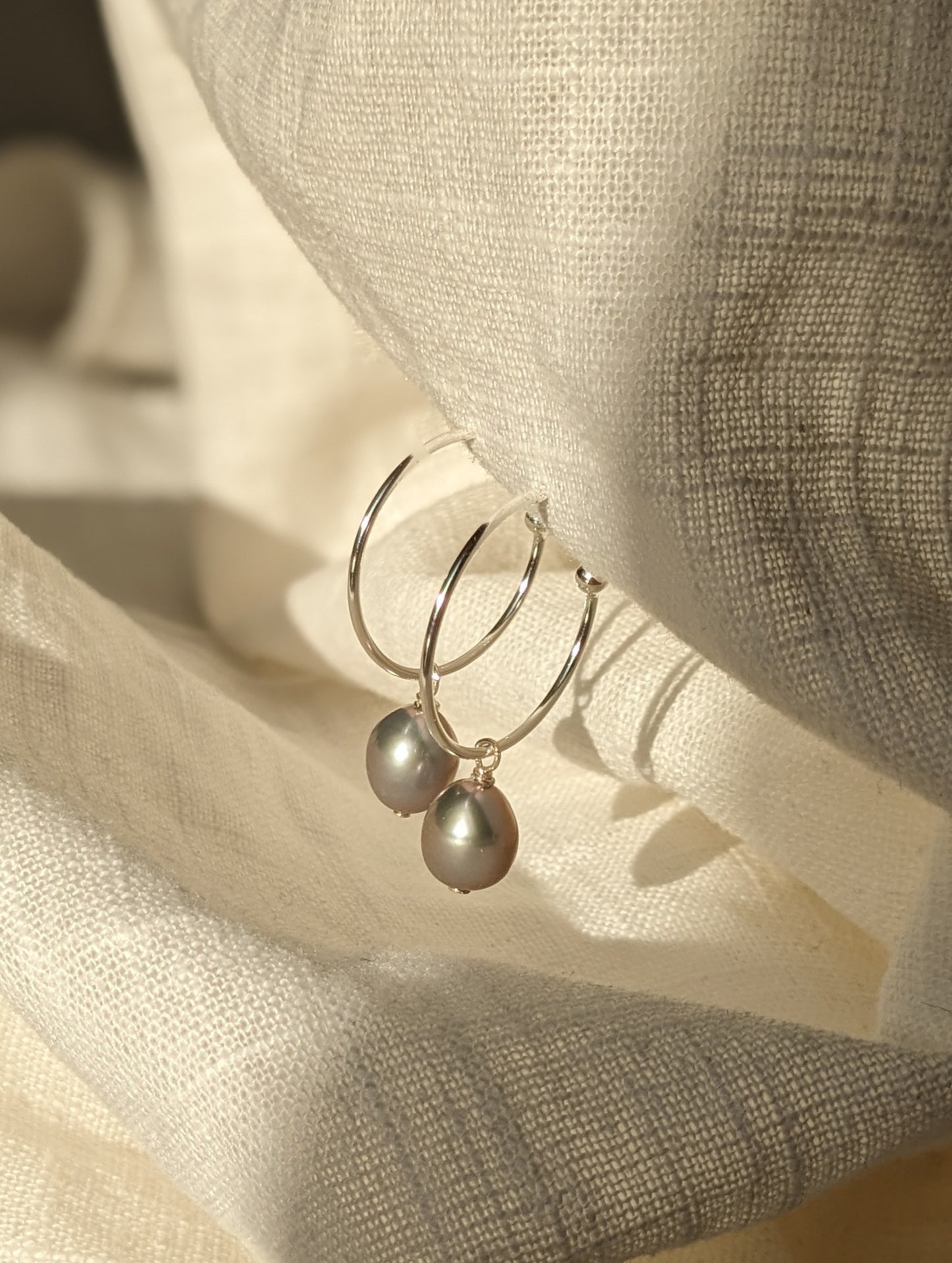 Pearl drop hoops in silver