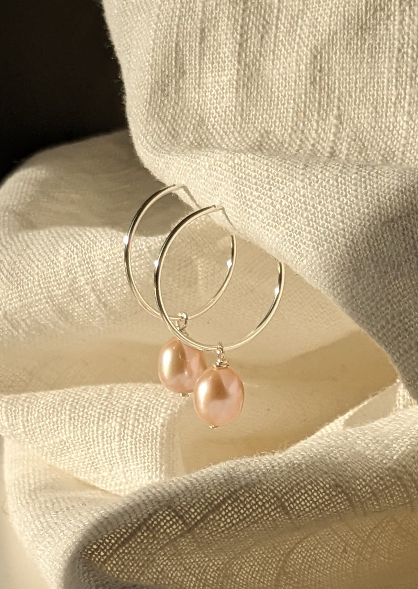 Pearl drop hoops in silver