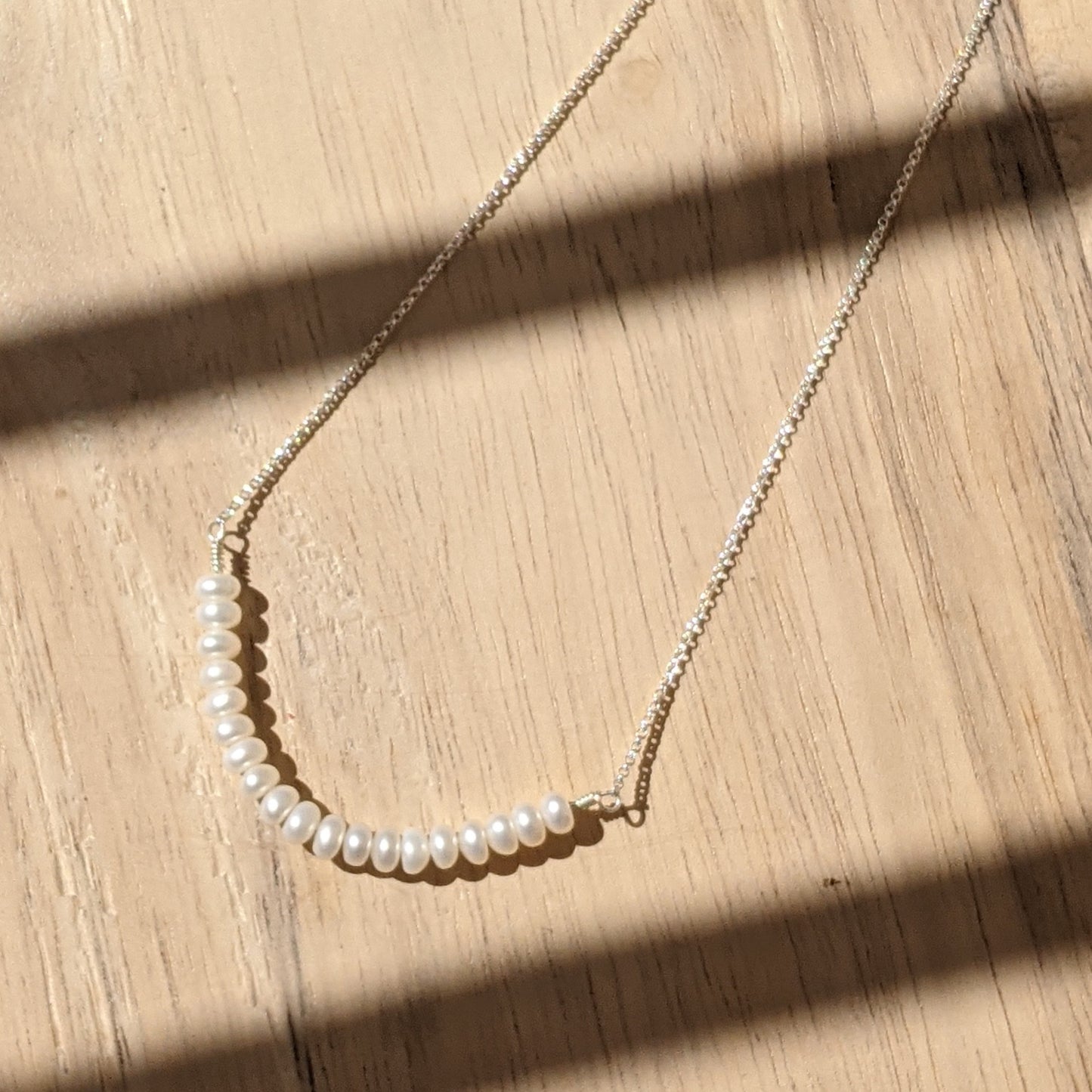 Pearl necklace on silver chain