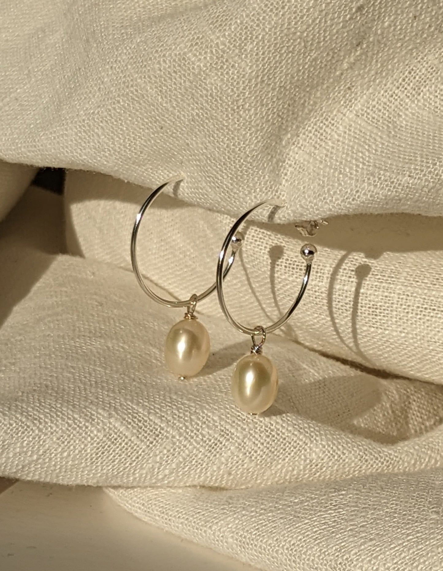 Pearl drop hoops in silver