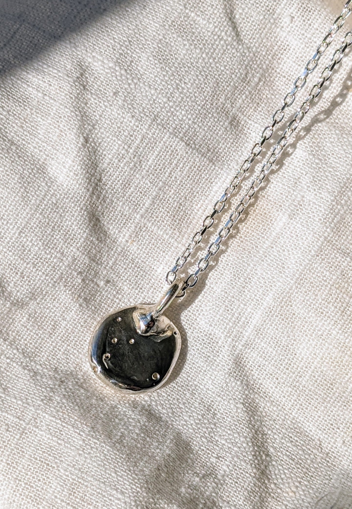 Molten Coniare Silver Pendant