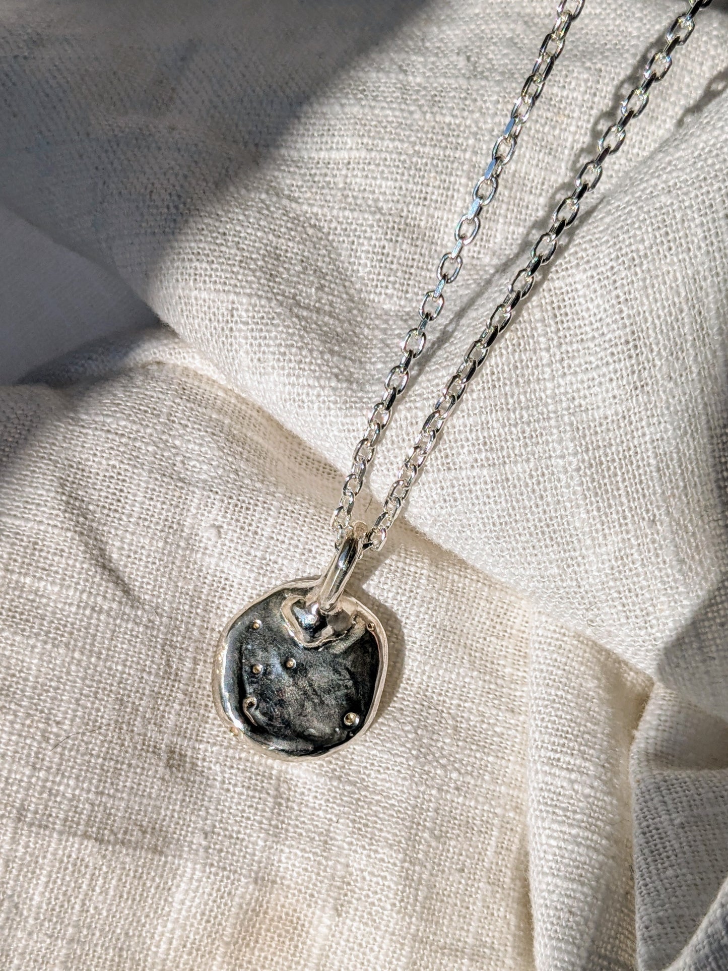 Molten Coniare Silver Pendant