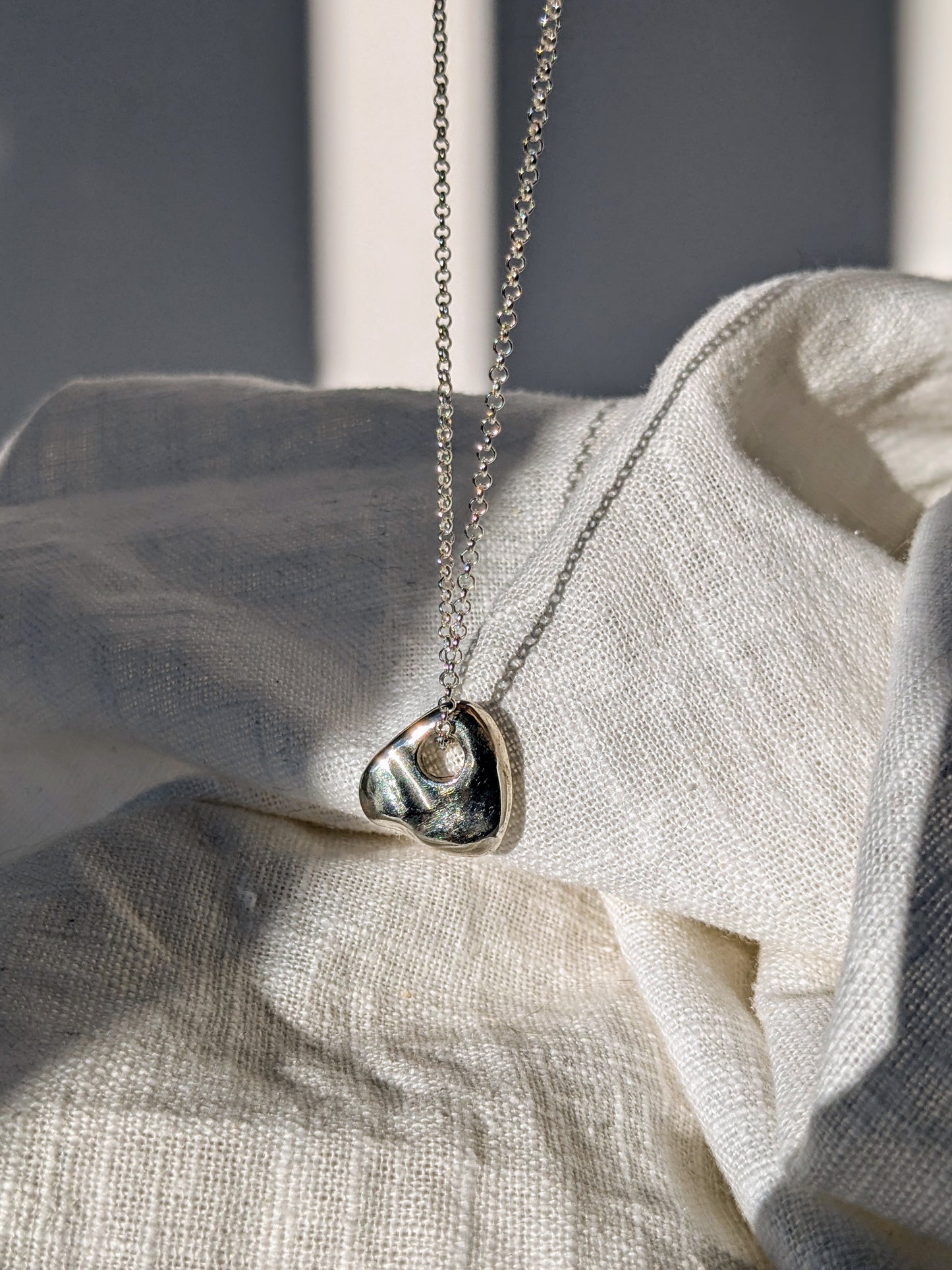 Amorphous Triangle Silver Pendant