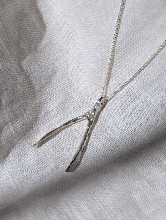 Untapped Potential silver Wishbone Pendant