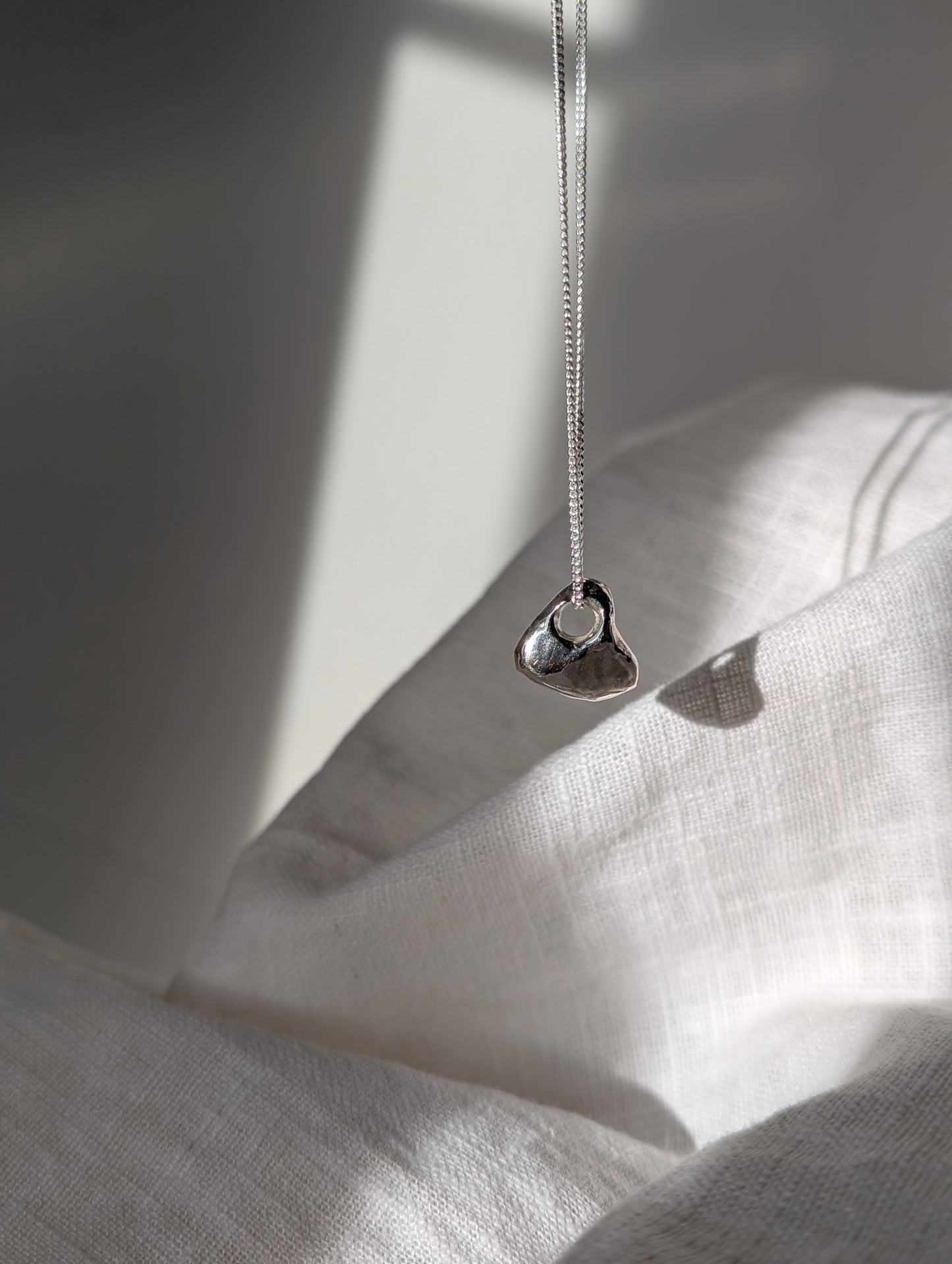 Hag stone silver necklaces