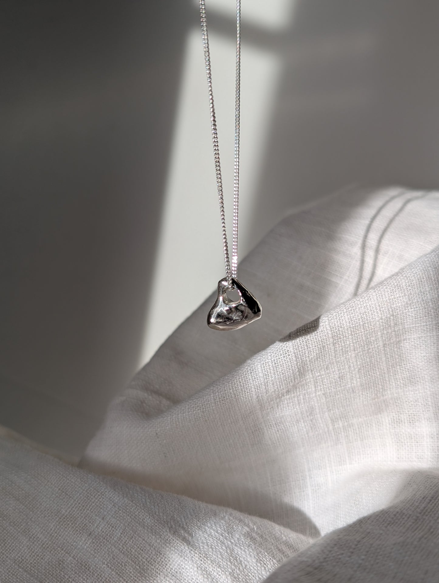 Hag stone silver necklaces