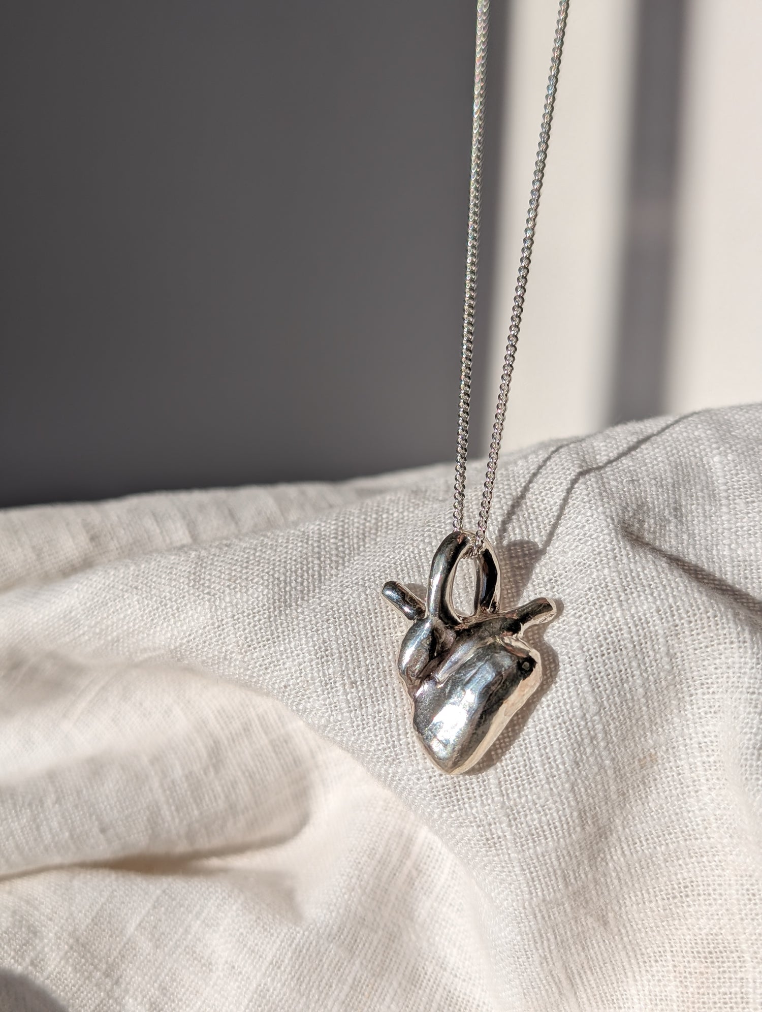 Anatomical solid silver heart necklace. 