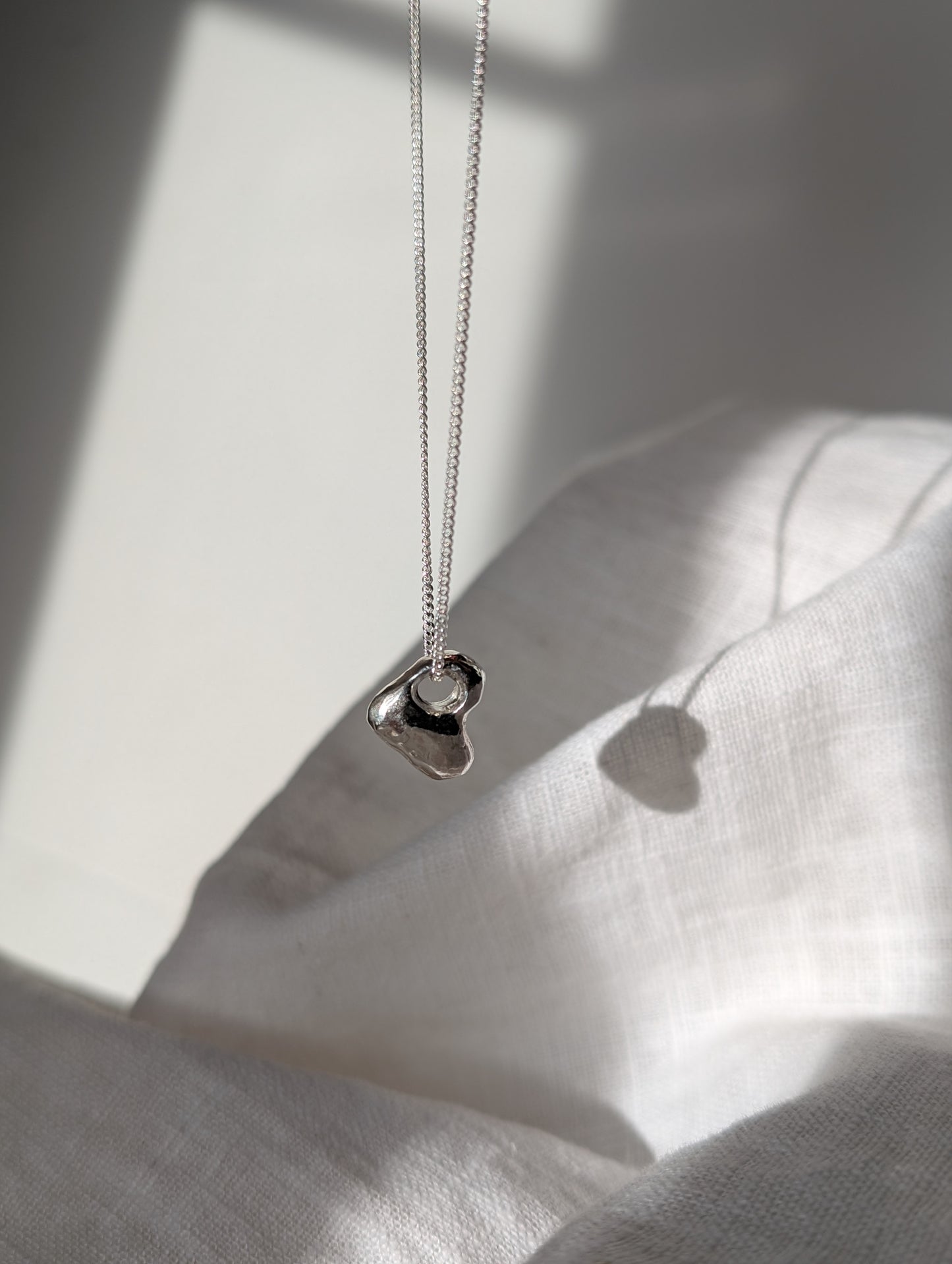 Hag stone silver necklaces