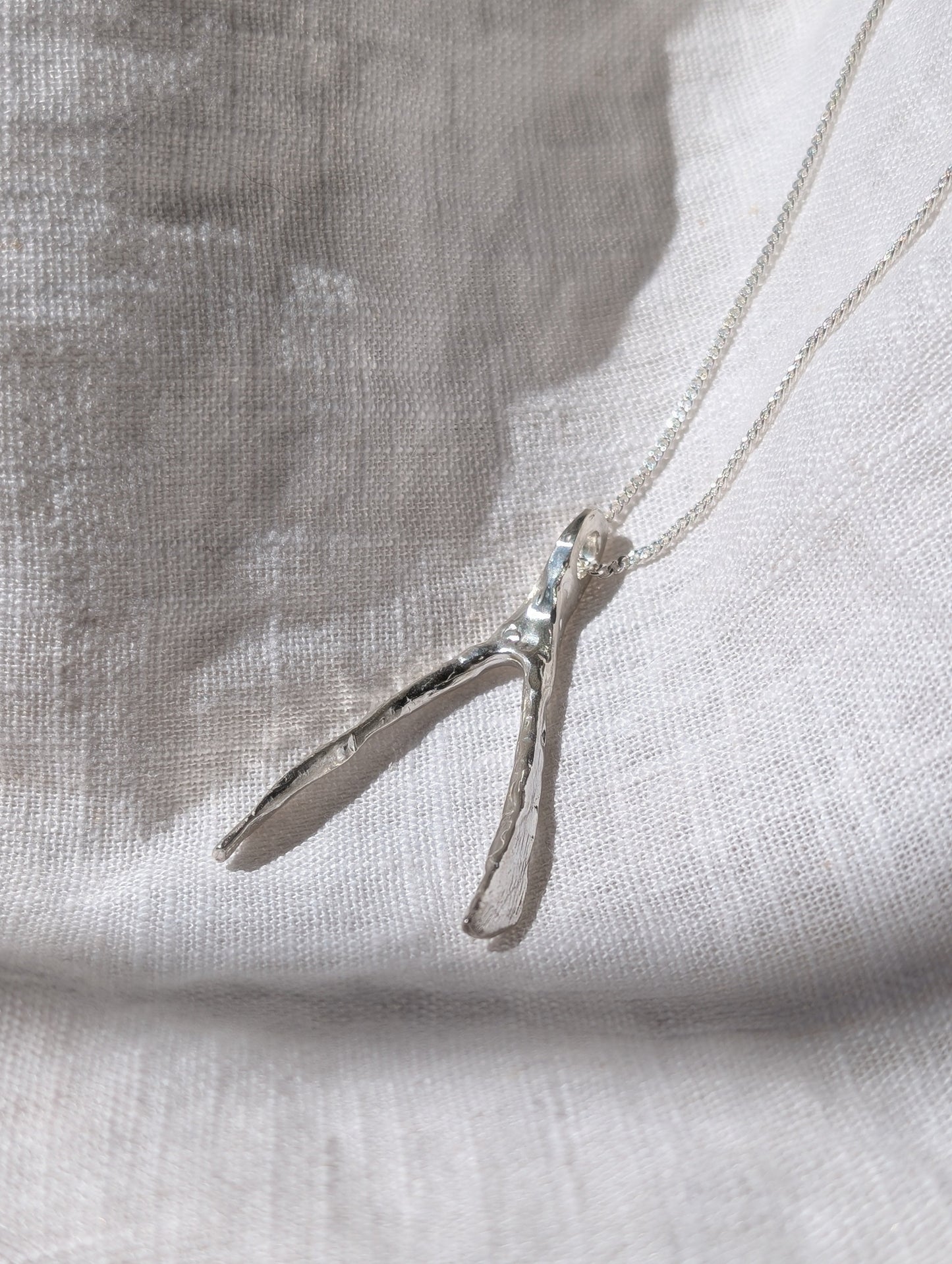 Untapped Potential silver Wishbone Pendant