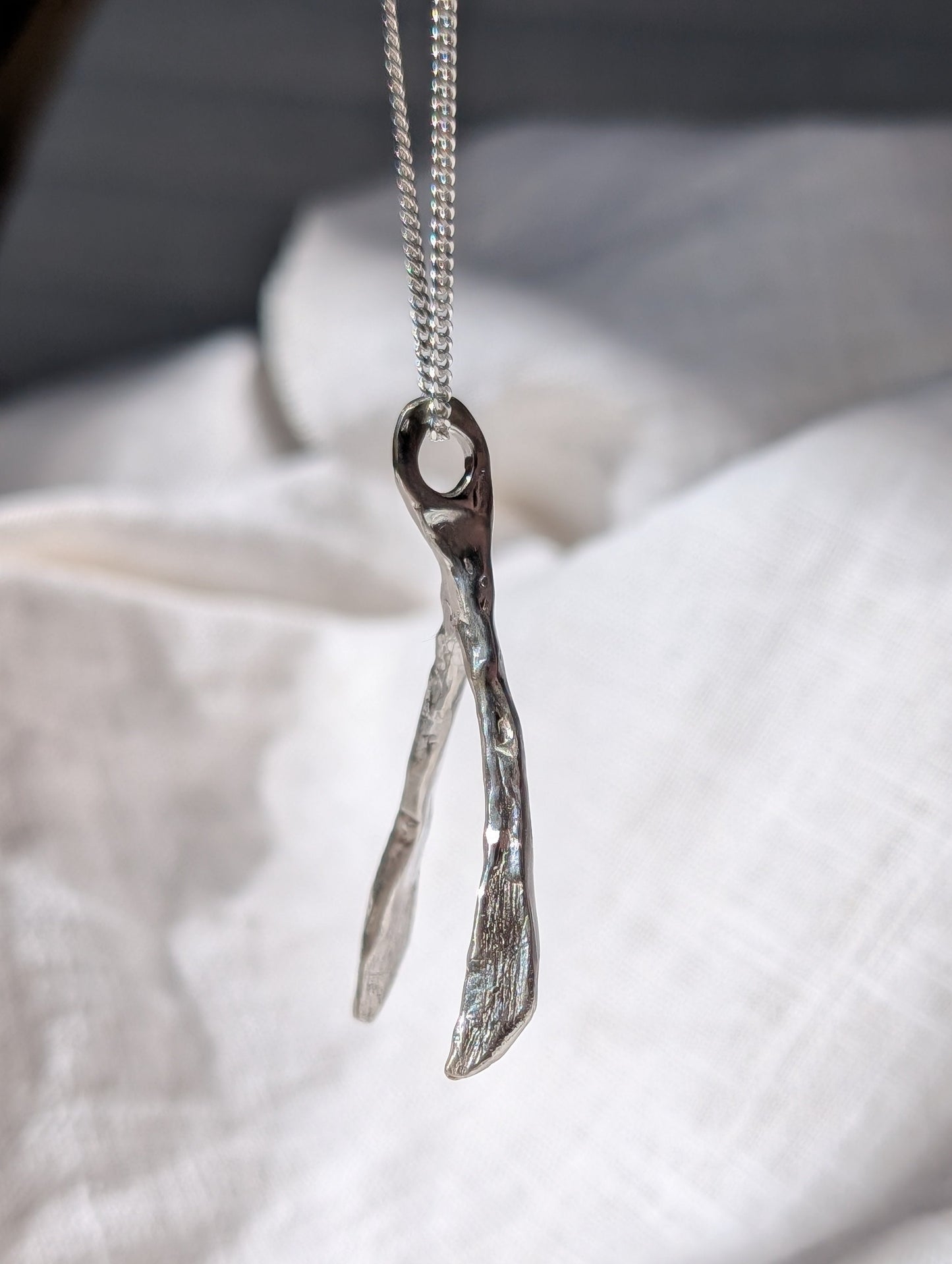 Untapped Potential silver Wishbone Pendant