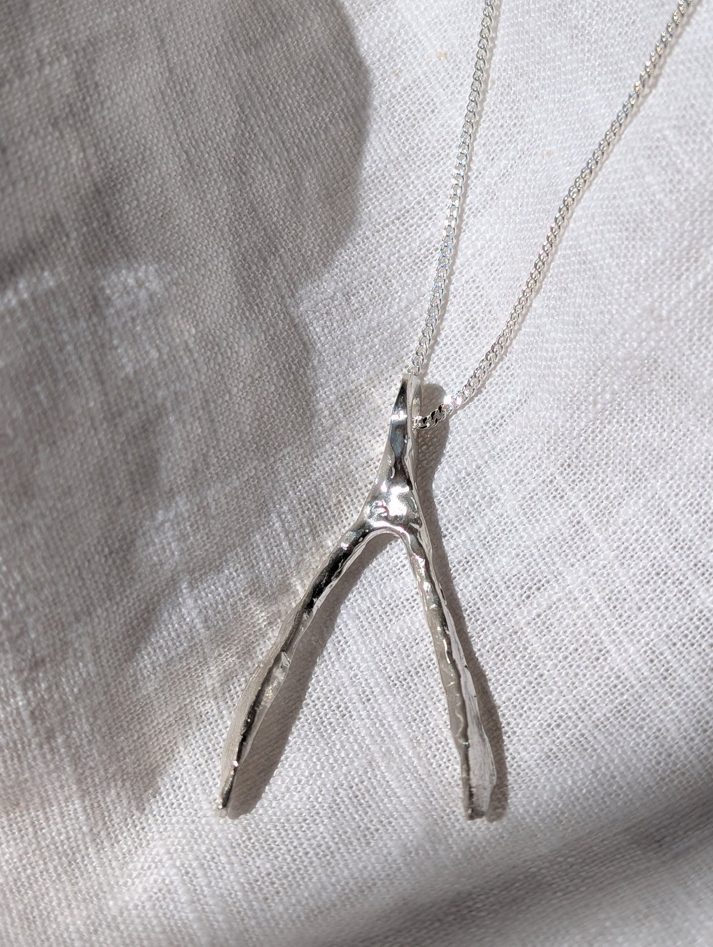 Untapped Potential silver Wishbone Pendant